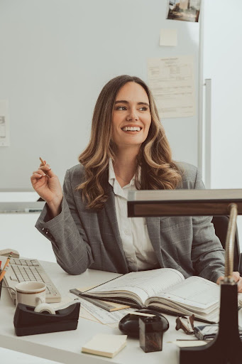 Photo of Steph Crowder sitting at her desk